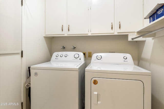 washroom featuring cabinet space and washer and dryer