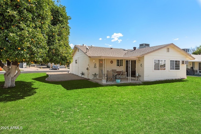 back of house featuring a patio, a yard, and central AC