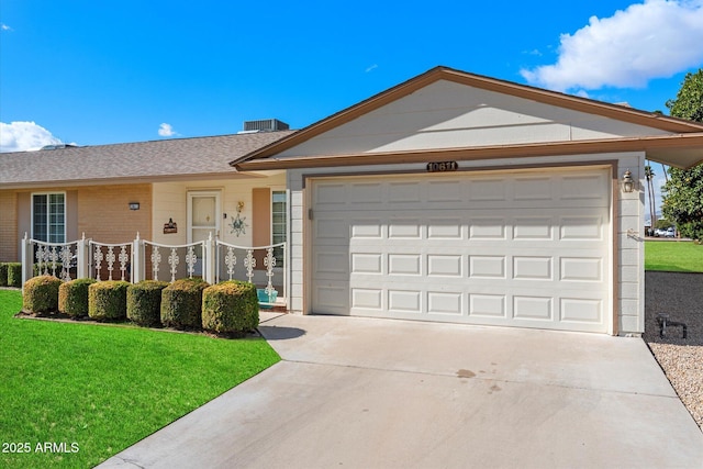 ranch-style home featuring an attached garage, driveway, brick siding, and a front yard