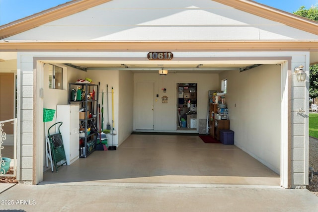 garage with concrete driveway