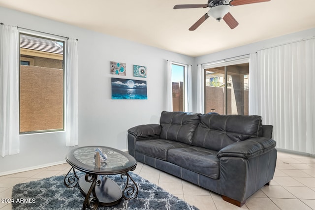 tiled living room featuring ceiling fan