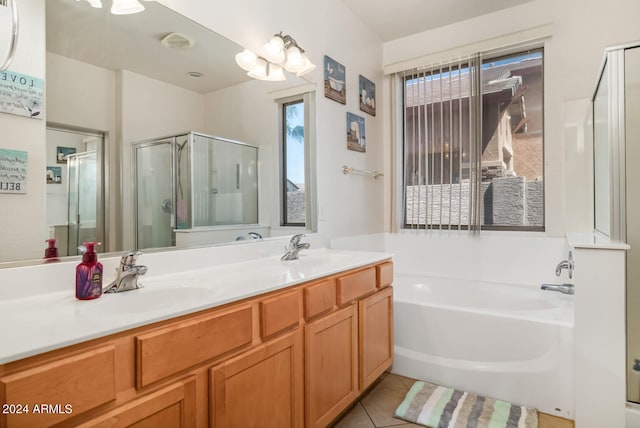 bathroom with vanity, tile patterned floors, and plus walk in shower