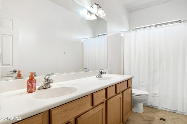 bathroom with vanity, toilet, a shower with curtain, and tile patterned floors