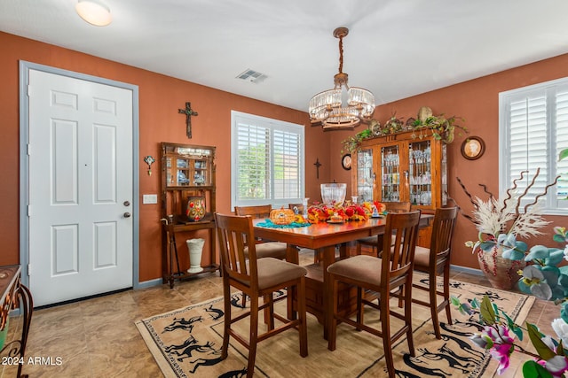 19104 N Smith Dr, Maricopa, AZ 85139 - dining area featuring an inviting chandelier and visible vents