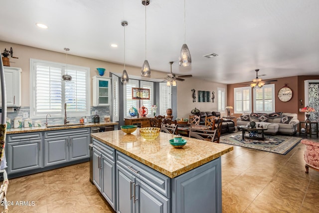 19104 N Smith Dr, Maricopa, AZ 85139 - kitchen featuring a sink, ceiling fan, a center island, and gray cabinetry