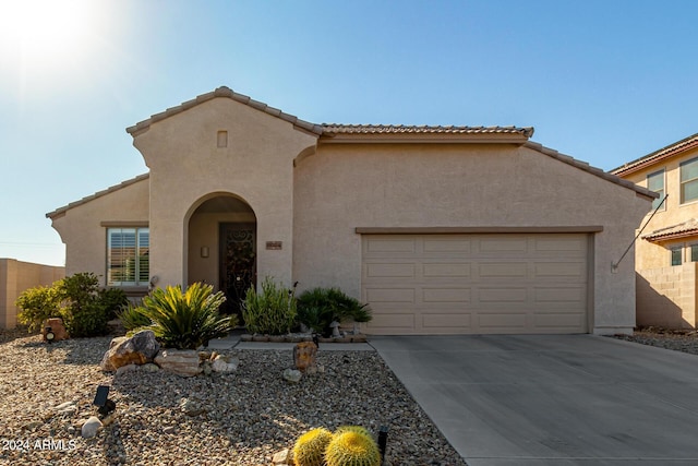 19104 N Smith Dr, Maricopa, AZ 85139 - mediterranean / spanish-style house with a garage, stucco siding, and concrete driveway