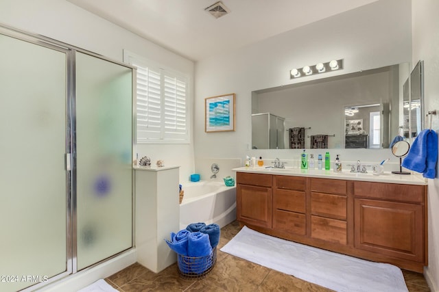 19104 N Smith Dr, Maricopa, AZ 85139 - bathroom with a garden tub, a shower stall, visible vents, a sink, and double vanity