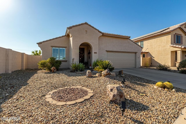 19104 N Smith Dr, Maricopa, AZ 85139 - mediterranean / spanish-style home with a tiled roof, an attached garage, driveway, and stucco siding