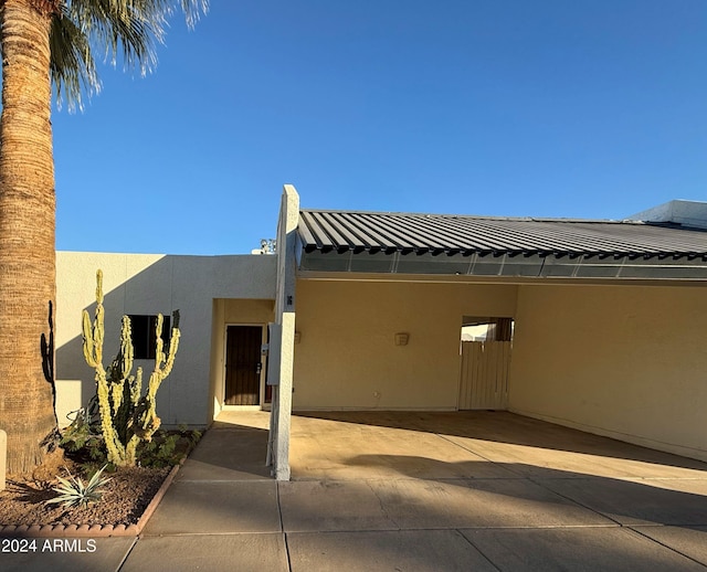 exterior space featuring a carport