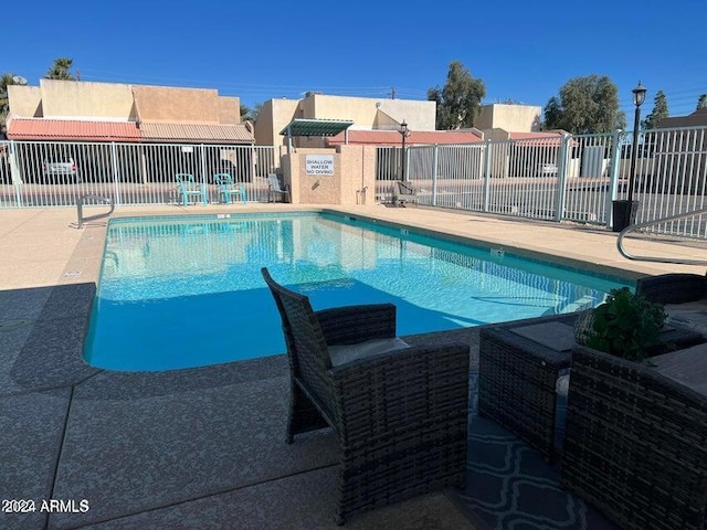 view of pool featuring a patio area