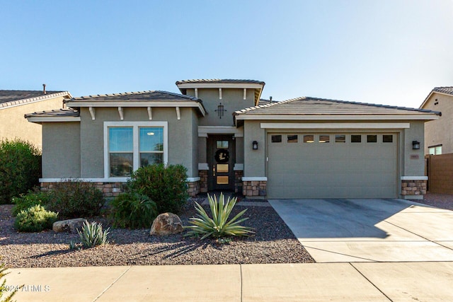 prairie-style house featuring a garage