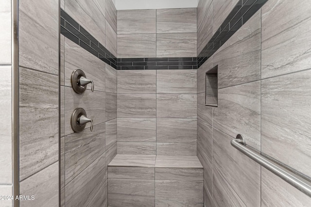 bathroom with tiled shower