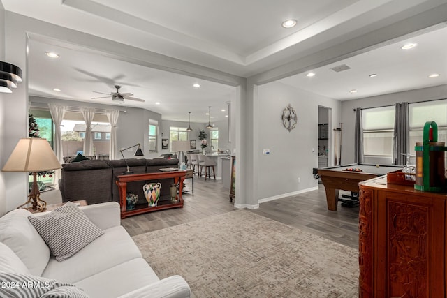 living room featuring ceiling fan and pool table