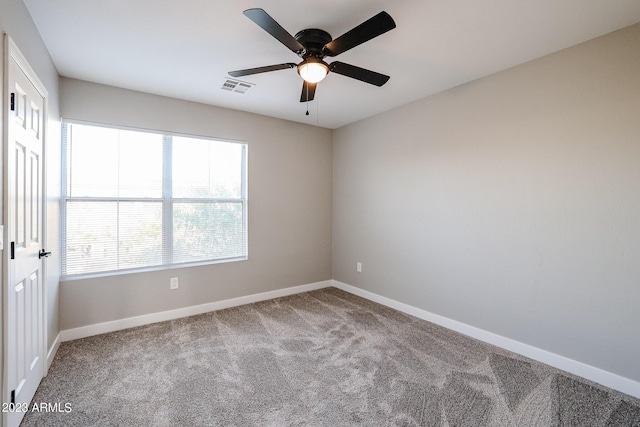 empty room featuring ceiling fan and carpet flooring