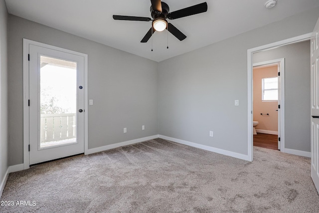 unfurnished room featuring ceiling fan and light colored carpet