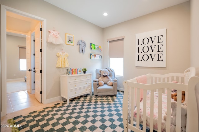 bedroom featuring a crib