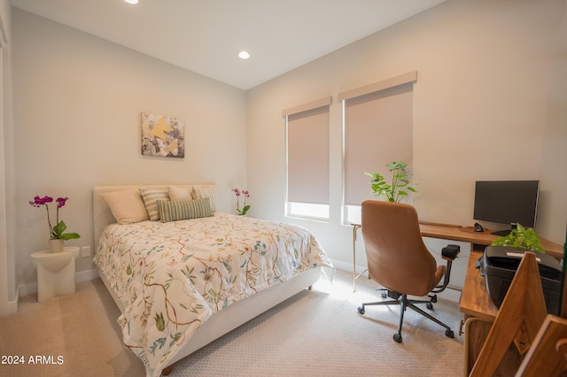 bedroom with light colored carpet