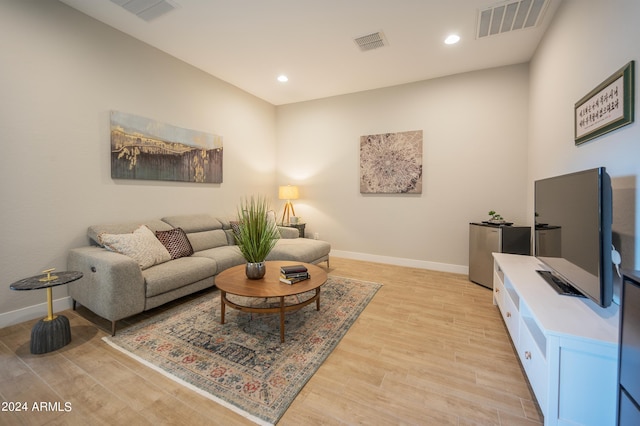 living room with light hardwood / wood-style floors