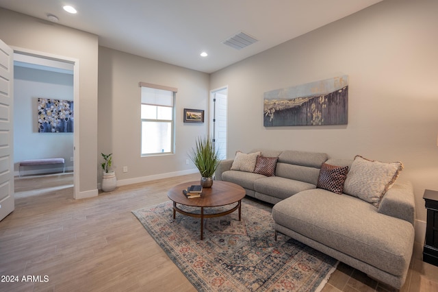 living room with light hardwood / wood-style floors