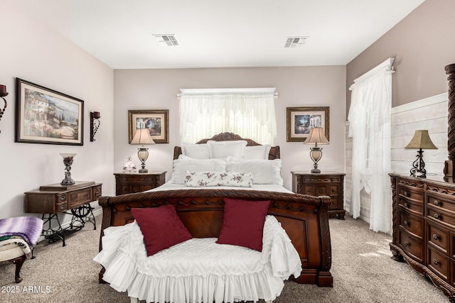 bedroom featuring light carpet and visible vents