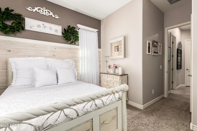 bedroom with carpet floors and baseboards