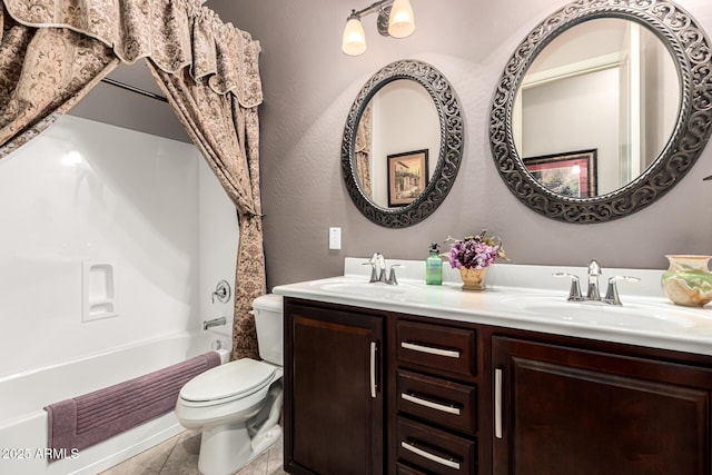 full bathroom featuring tile patterned flooring, a sink, toilet, and double vanity