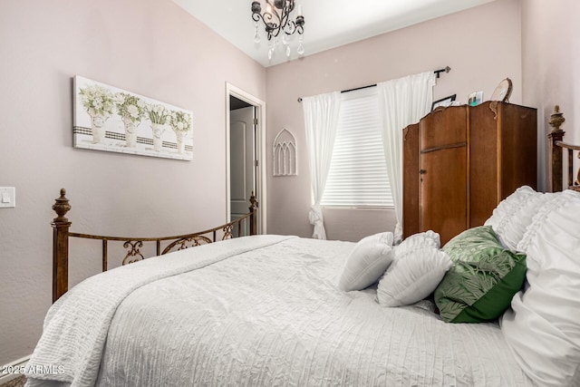 bedroom with a chandelier