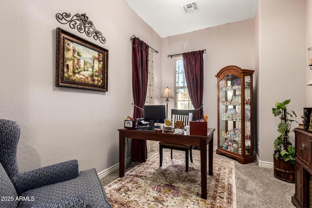 office with carpet floors, visible vents, and baseboards