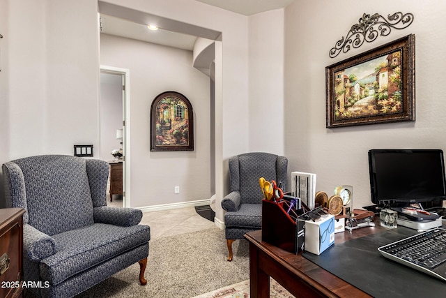 living area with tile patterned flooring and baseboards