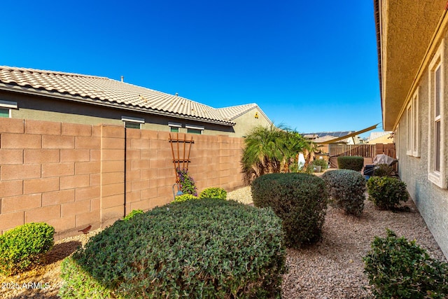 view of yard with a fenced backyard