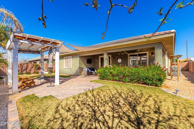 back of house featuring a patio area, fence, a pergola, and stucco siding