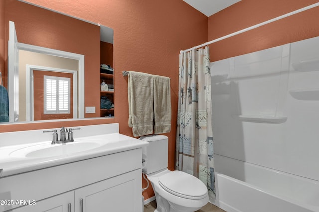 full bathroom with vanity, toilet, and shower / bath combo with shower curtain