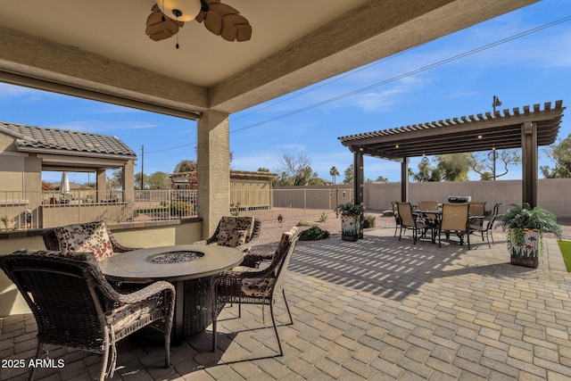 view of patio / terrace featuring a pergola, ceiling fan, and an outdoor fire pit