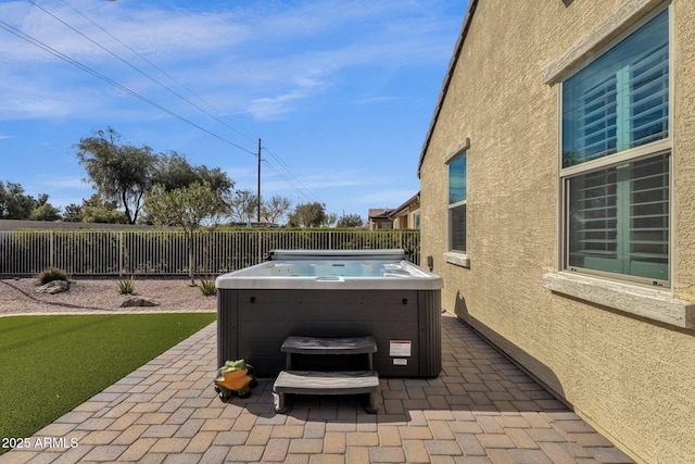 view of patio / terrace featuring a hot tub