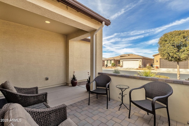 view of patio featuring a garage