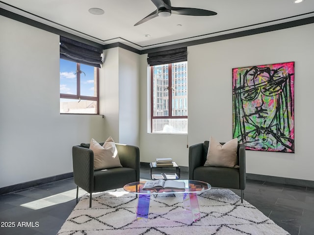 114 W Adams St Ph, Ph, Phoenix, AZ 85003 - living area featuring baseboards, ceiling fan, and ornamental molding
