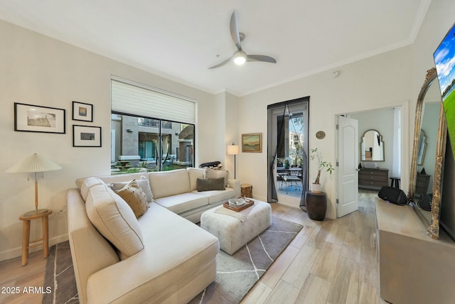 living room featuring crown molding, ceiling fan, and light hardwood / wood-style flooring