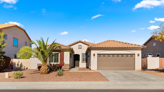 mediterranean / spanish-style house featuring a garage