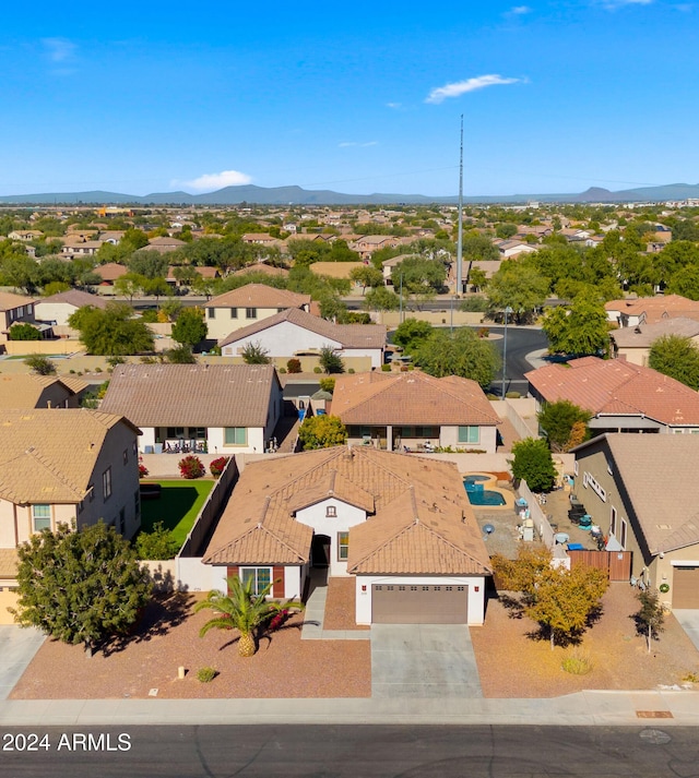 birds eye view of property with a mountain view