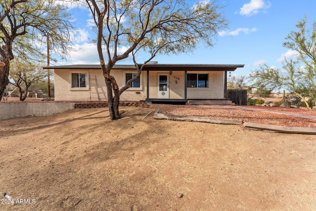 ranch-style home with covered porch