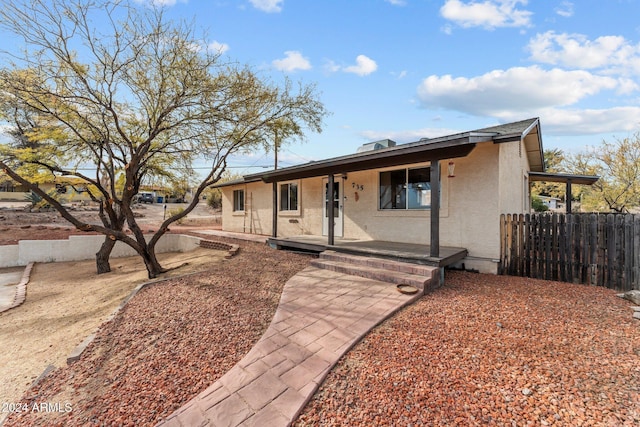 ranch-style house with covered porch