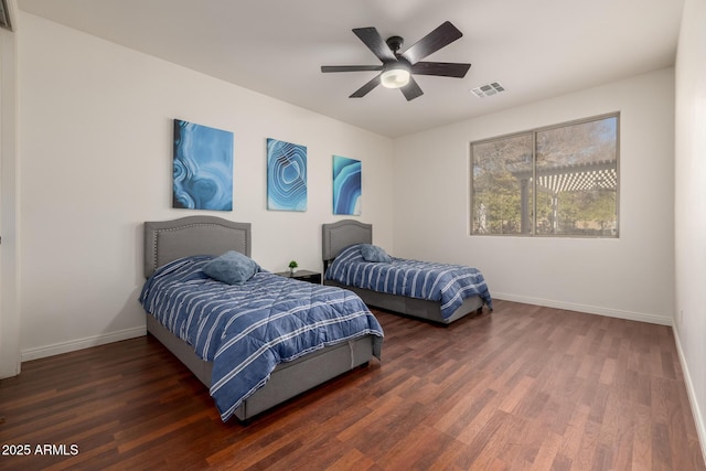 bedroom featuring ceiling fan and dark hardwood / wood-style flooring