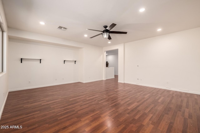 unfurnished room with ceiling fan and dark hardwood / wood-style floors