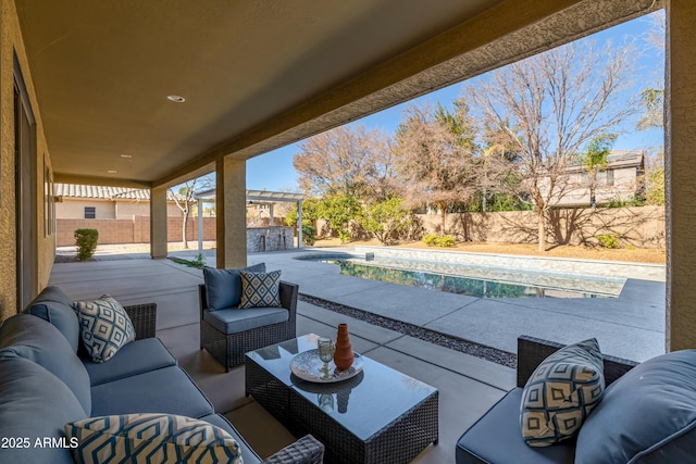 view of patio / terrace featuring a fenced in pool and outdoor lounge area