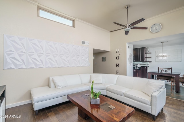 living room featuring dark wood finished floors, visible vents, and ornamental molding