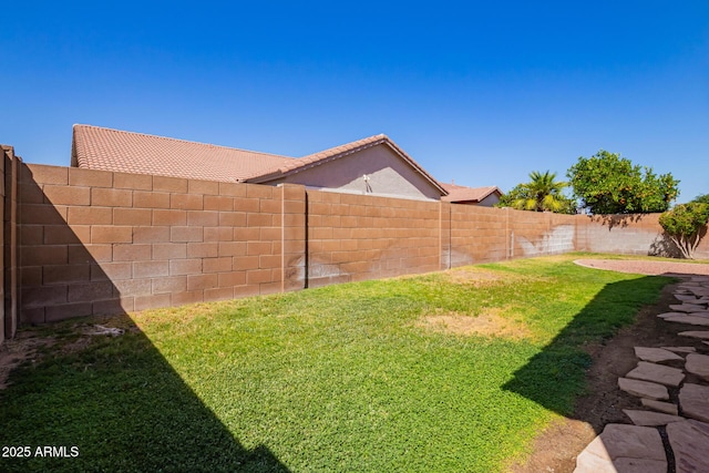 view of yard with a fenced backyard