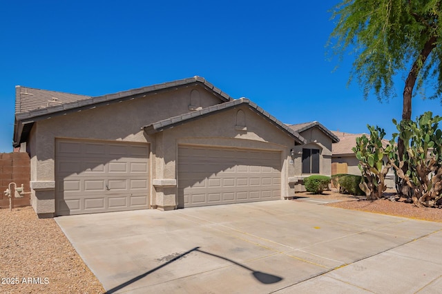 ranch-style house with a garage, stucco siding, driveway, and a tiled roof