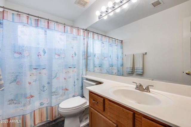 bathroom featuring toilet, a shower with shower curtain, vanity, and visible vents