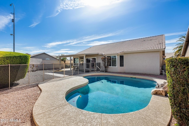 view of swimming pool with a patio area, a fenced backyard, and a fenced in pool