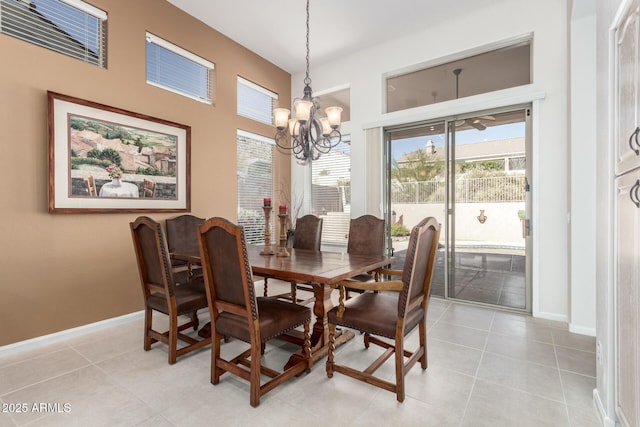 dining space with light tile patterned floors and a chandelier